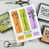 Card using the stripe panel of the 3-in-1 stencil with colorful blended ink columns.