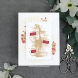 Elegant white card of the deer stamped in gold with Peace, Joy and Love labels and star accents.