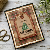 Plaid Christmas card with the spruce tag tied with a button and twine