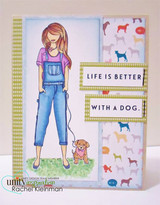 The girl in a purple tee walking her dog on a card layered with dog-print papers, captioned 'Life is better with a dog.'