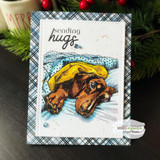 Card of the dachshund on a blue plaid panel with "sending hugs."
