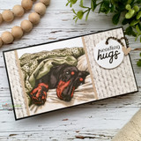Card of the colored brown dachshund lounging over script paper, "sending hugs."