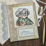 A silver-haired lady in glasses and a cozy scarf stamped in red rubber and colored on a handmade card reading "Sometimes I talk to myself and we both laugh."