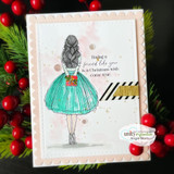 Christmas card of the girl in a teal-green dress on a blush polka-dot panel with a washi accent and red berries.
