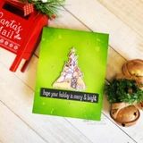 Card with the dog tree over a green ink background and 'hope your holiday is merry & bright.'