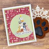 Card with the dog Christmas tree in a circle over bone-print paper with a paw die-cut and 'Woofy Christmas.'