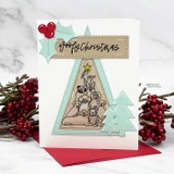 Card with the dog tree on a mint triangle with holly and 'Woofy Christmas.'