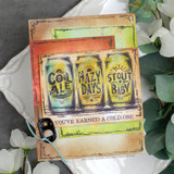 Card using the paper pack: three vintage ale cans with 'You've earned a cold one.'