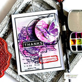 Card of the poppy in a black frame stamped "THANKS" with paint accents.