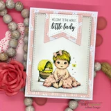 Card with a scalloped banner die and a stamped baby and 'welcome to the world, little lady'