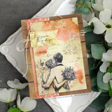 Card with the Scallops & Banners dies framing a seated figure with a sunflower