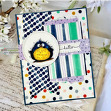 Card with a banner die framing a fluffy bird and 'hello'