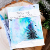 Card with a pine tree on a purple-and-blue watercolor sky, 'Trust in yourself. You are capable and resilient, dear one.'