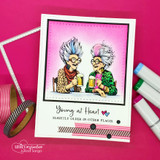 Hot-pink card with the grannies toasting under 'Young at Heart, slightly older in other places' with washi accents.