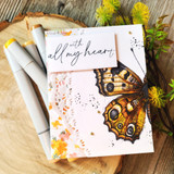 Card with the amber butterfly on a soft splattered panel: 'all my heart.'