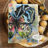 Mixed-media card with the butterfly in rainbow tones: 'love.'
