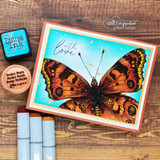 Card with the amber butterfly on a bright teal-orange frame: 'with love.'