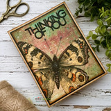 Grungy card with the butterfly in earth tones: 'thinking of you.'
