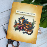 Tigger lounges on a mossy log with 'Life's all about the bounce back,' a Winnie the Pooh red rubber stamp shown on a handmade card.