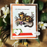Tigger lounges on a mossy log with 'Life's all about the bounce back,' a Winnie the Pooh red rubber stamp shown on a handmade card.