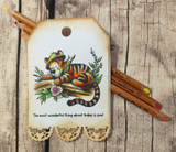 Tigger lounges on a mossy log with 'Life's all about the bounce back,' a Winnie the Pooh red rubber stamp shown on a handmade card.