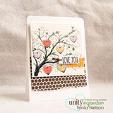 A whimsical swirled tree hung with hearts hand-stamped on a card and lettered "I really, really love you."