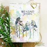 'Beyond grateful' tree card layered over Blossom Avenue papers.