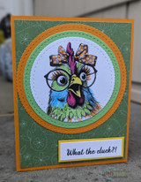 A cardmaking project featuring a wide-eyed hen in round glasses and a hair bow from Unity Stamp Co's What the Cluck?! red rubber stamp set, with the sentiment 'You're how old?'.