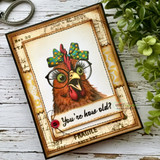 A handmade greeting card with a wide-eyed hen in round glasses and a hair bow from Unity Stamp Co's What the Cluck?! red rubber stamp set, with the sentiment 'Poultry in disbelief.'.