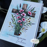 Soft blue card of the cross with pink wildflowers and the in-your-own-time sentiment