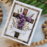 Purple-flowered cross card with 'I am here. Still. Always' in a rustic frame