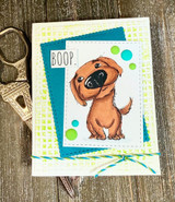 A cardmaking project featuring an adorable big-nosed puppy from Unity Stamp Co's Boop the Snoot red rubber stamp set, with the sentiment 'In dog years you are a zillion.'.