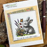 Card with the bunny sniffing a butterfly among wildflowers: 'You make the world a little brighter.'