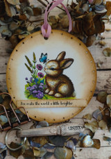 Round ornament card with the bunny and wildflowers: 'You make the world a little brighter.'