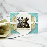 Card with the bunny and wildflowers on a teal panel: 'You make the world a little brighter.'