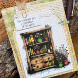 Green-trimmed card of a book hutch stuffed with colorful spines, 'Our friendship is a cozy nook in this world'