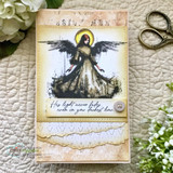 Card made with Vintage Volumes paper - a stamped and colored angel on an aged panel, layered over faded script and lace-edged papers with a small button.