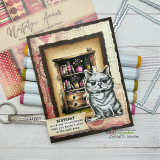 Journal-style page with the grey cat beside a collaged bookshelf and lettered sentiments.