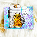 Bright rainbow mixed-media card with the ginger cat over polka dots and grid paper, 'hey cool cat' tag at the top right.