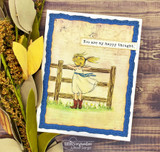 Card with a navy scalloped frame: the girl in a blue dress at the fence, colored in soft pencil, above a small “You are my happy thought” strip.