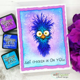 Card showing the spiky-feathered crazy chicken on a purple and blue distress-ink background, "Just chicken in on you" sentiment, ink pads beside it