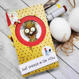 Yellow polka-dot card with the frazzled chicken inside a red circle, "Just chicken in on you," eggs as props