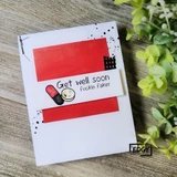 Card with the capsule get-well stamp on a bold red panel against greenery, from Unity's adults-only EDGY line.