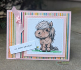 Pastel birthday card with the pony on a striped mat and pink ribbon, sentiment reads 'Hay, happy birthday.'