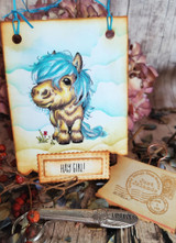 Vintage-style gift tag with a blue-maned pony among painted clouds and a stamped 'Hay girl!' label.