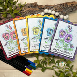 Rainbow stack of scalloped pansy tags in five bright colorways