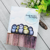 Handmade card with a row of plump fluffy little birds huddled together on a branch, sentiment 'friends are life's true treasures'.