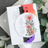 Card with the florals in a circle over script paper, 'I love how we don't have to say out loud that I'm your favorite child.'