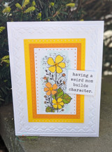 White embossed card with the wildflowers, 'having a weird mom builds character.'