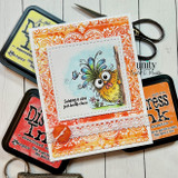 Card with the bandana background stamped in orange and red framing a quirky bird and 'Sending a little birdie hello.'